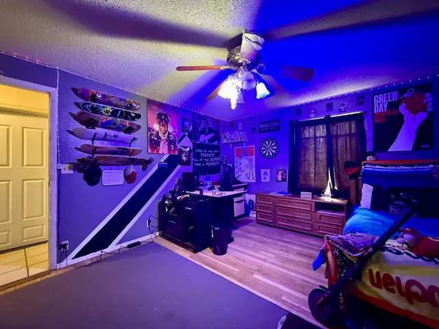 a bed room with a bed and a chandelier