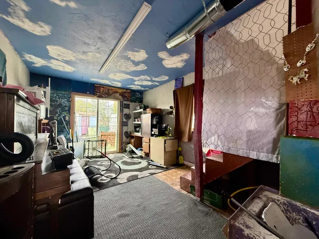 a room with furniture and a window