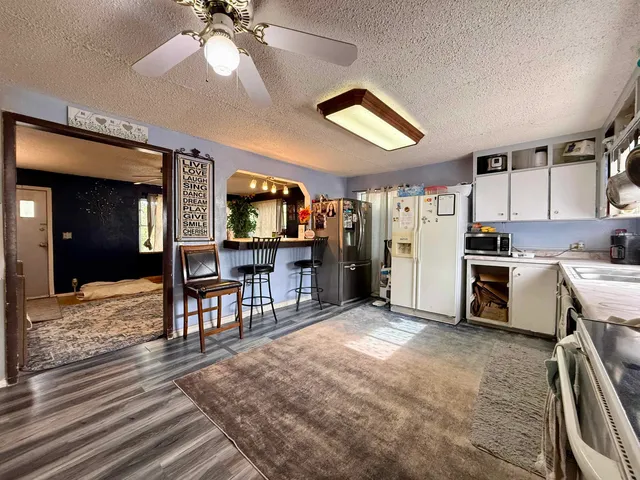 a view of a kitchen and dining room