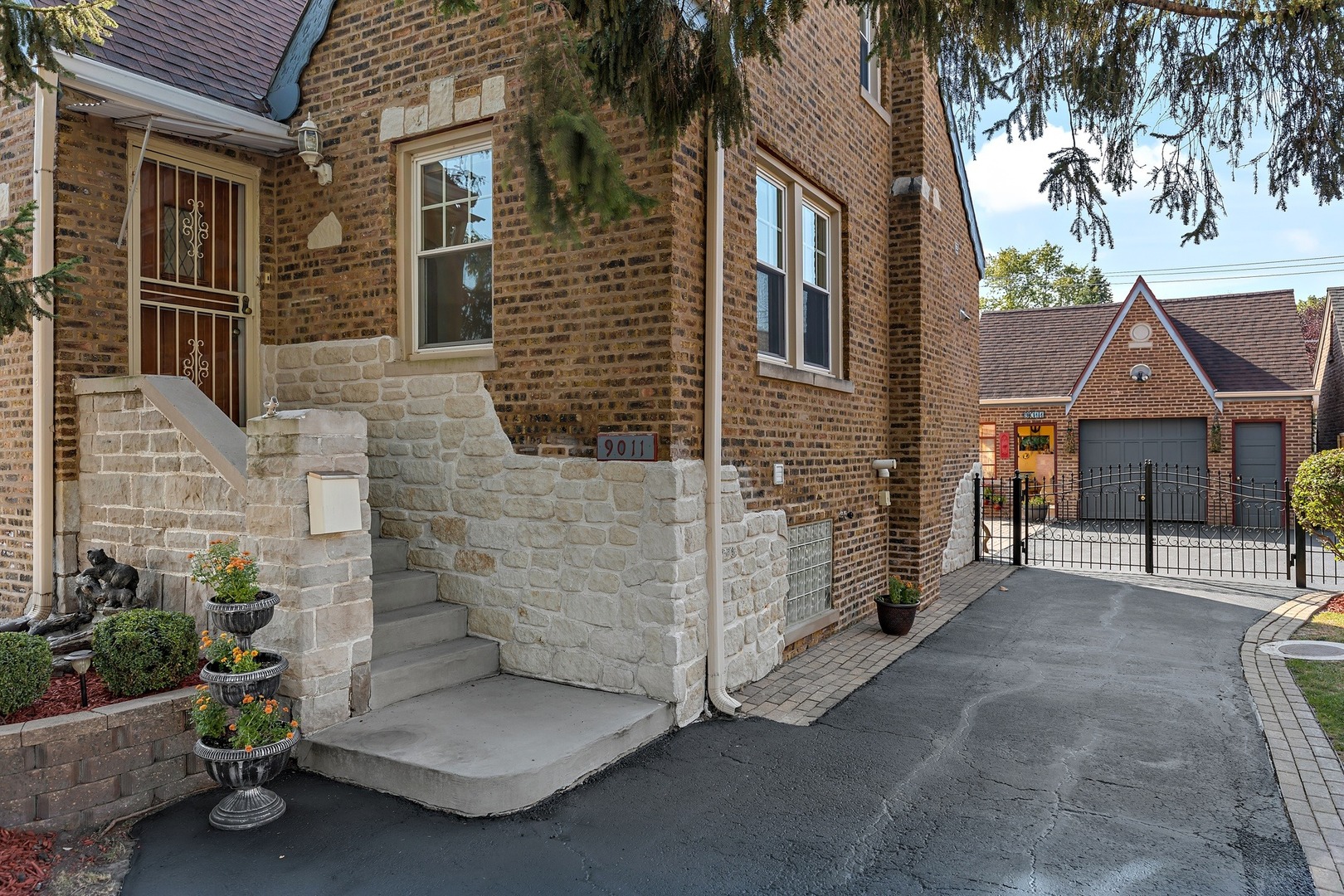 9011 24th Street Riverside, IL 60546 - Photo 2 of 22 a view of brick house with many windows