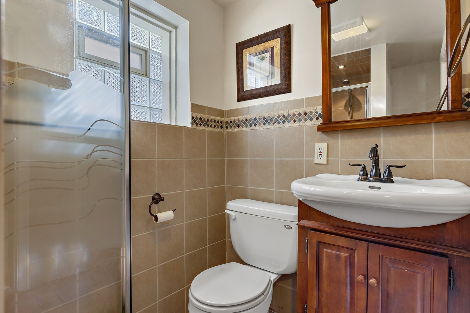 9011 24th Street Riverside, IL 60546 - Photo 16 of 22 a bathroom with a toilet sink and mirror