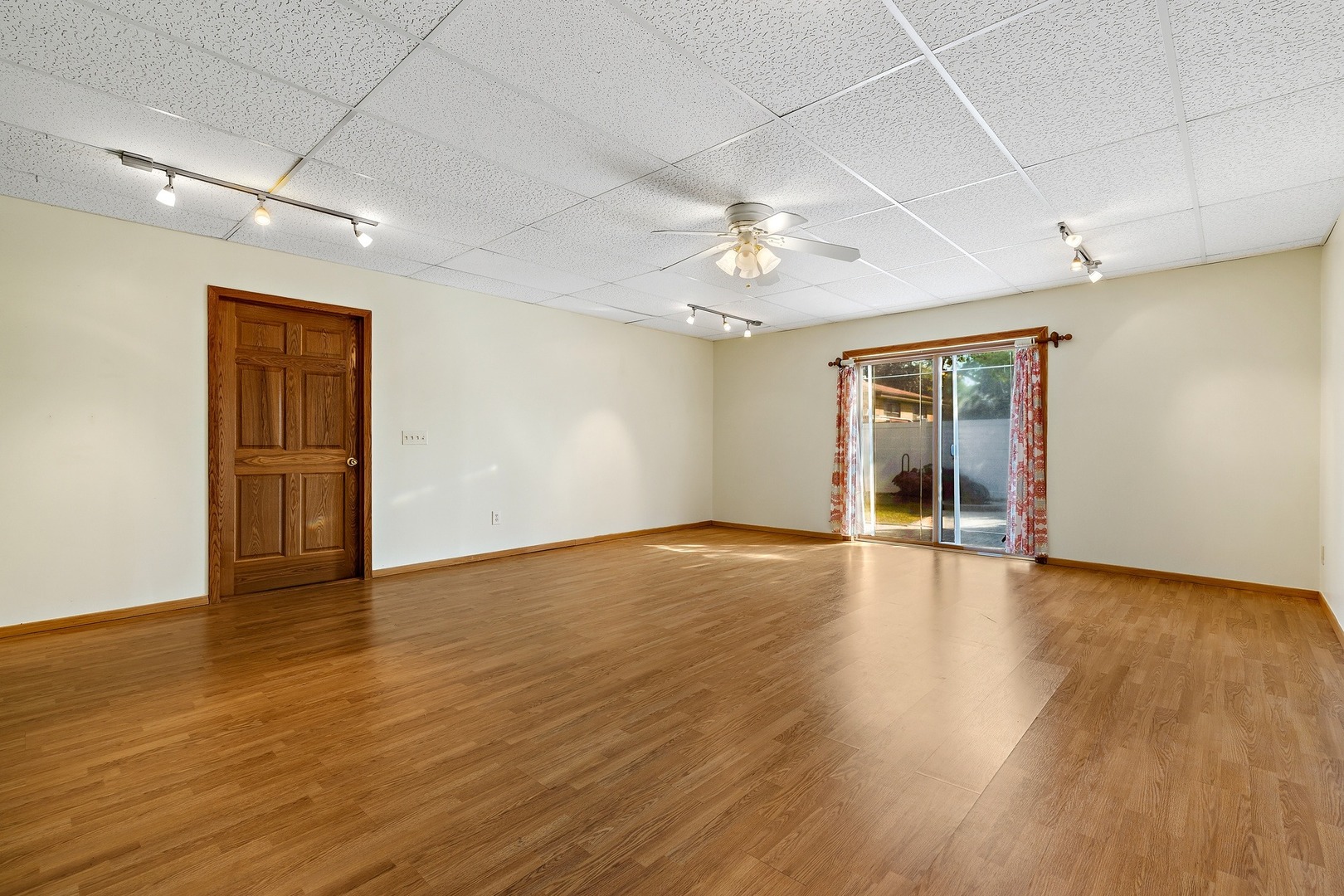 9011 24th Street Riverside, IL 60546 - Photo 20 of 22 a view of an empty room with wooden floor and a window