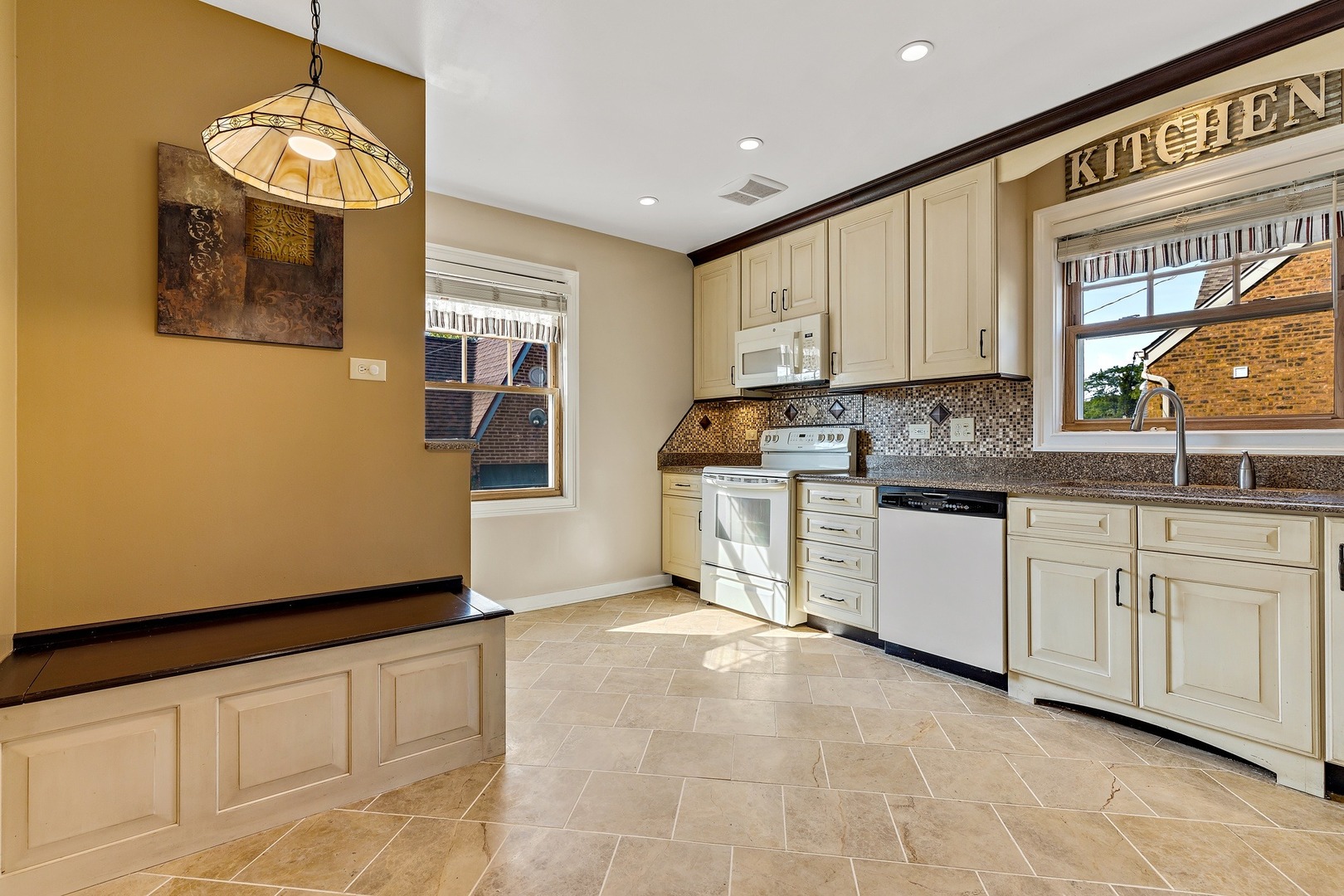 9011 24th Street Riverside, IL 60546 - Photo 5 of 22 a kitchen with cabinets a sink and appliances