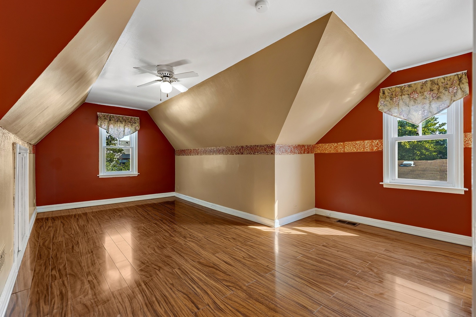 9011 24th Street Riverside, IL 60546 - Photo 9 of 22 wooden floor in an empty room with a window