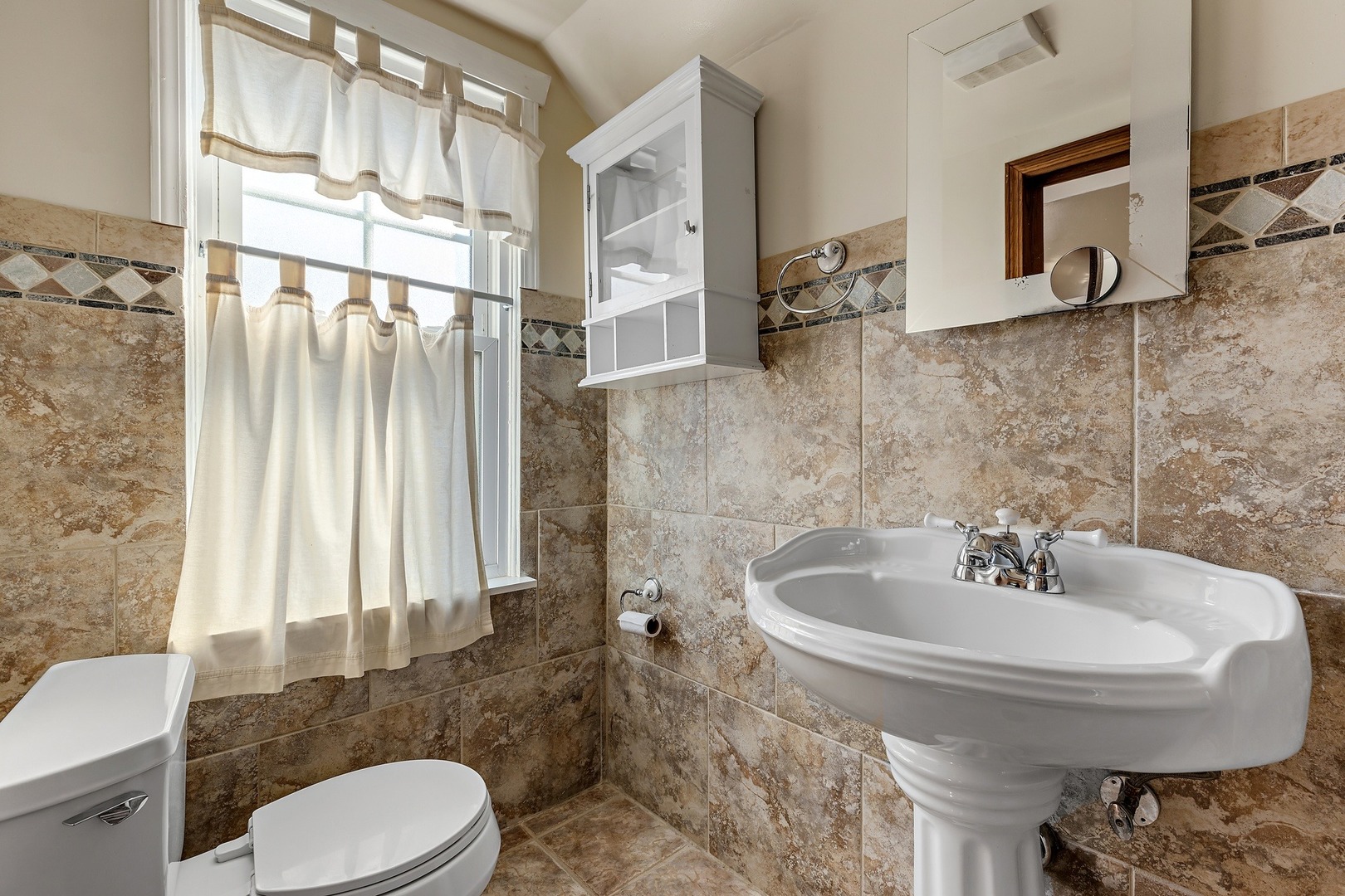9011 24th Street Riverside, IL 60546 - Photo 10 of 22 a bathroom with a sink toilet and shower