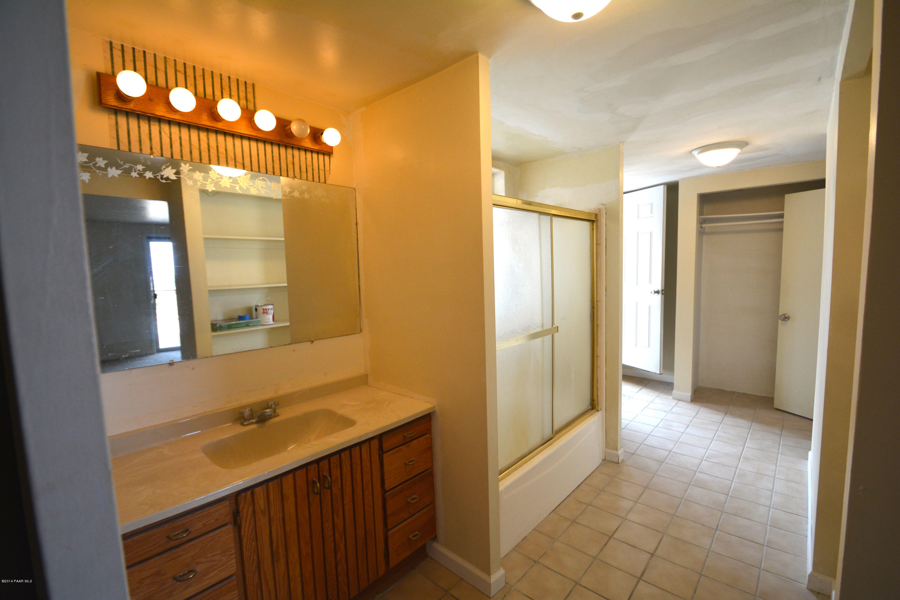 2700 Ridge Road Prescott, AZ 86301 - Photo 23 of 28 a bathroom with a double vanity sink a mirror and a shower