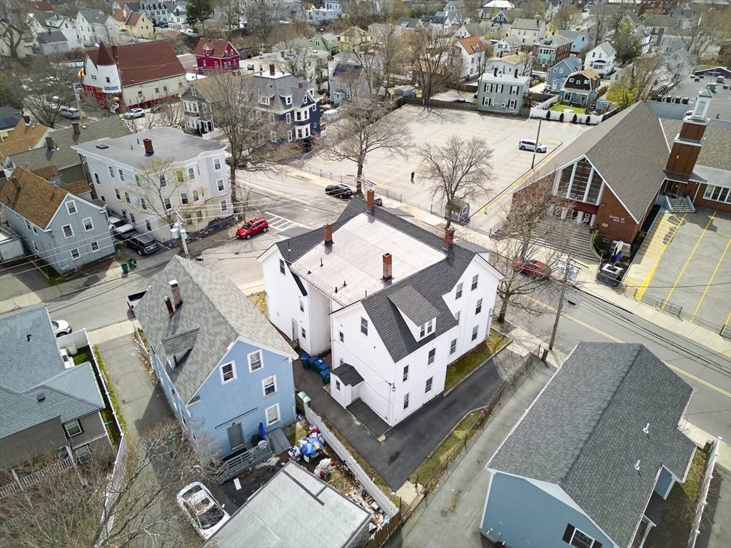 133 Chestnut Street Lynn, MA 01902 - Photo 12 of 12 an aerial view of a house with a swimming pool