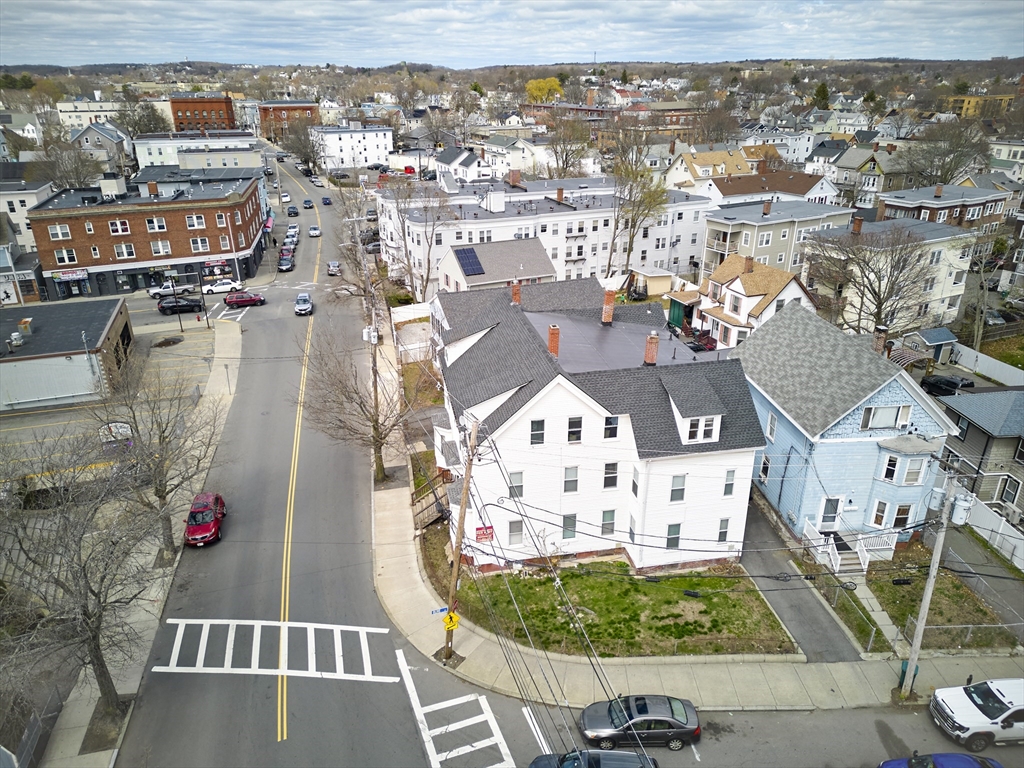 133 Chestnut Street Lynn, MA 01902 - Photo 10 of 12 an aerial view of residential houses with outdoor space