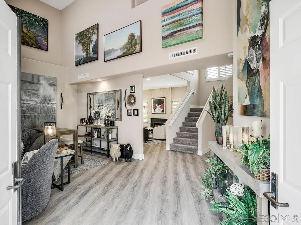 4843 Marathon Way Oceanside, CA 92056 - Photo 11 of 75 a view of a livingroom with furniture staircase and a living room