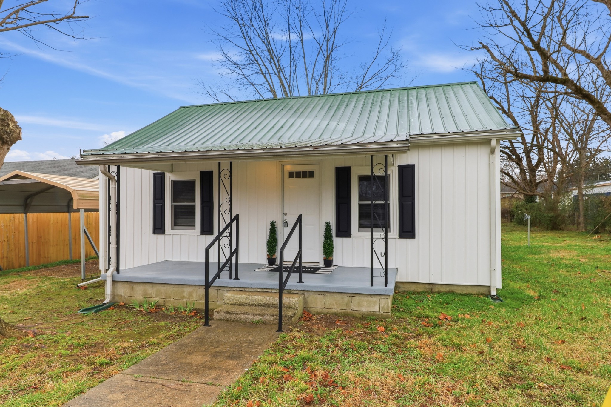 612 Maple Street Manchester, TN 37355 - Photo 2 of 20 a view of a house with backyard and a tree