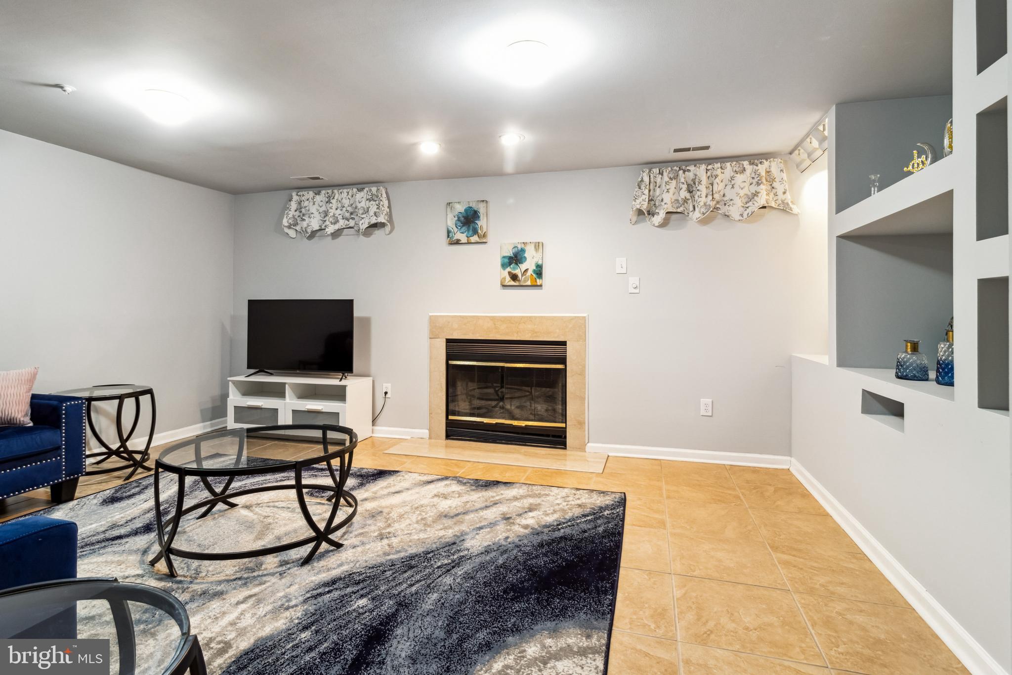 5209 Red Hill Way Rosedale, MD 21237 - Photo 17 of 36 Lower level recreation room with fireplace