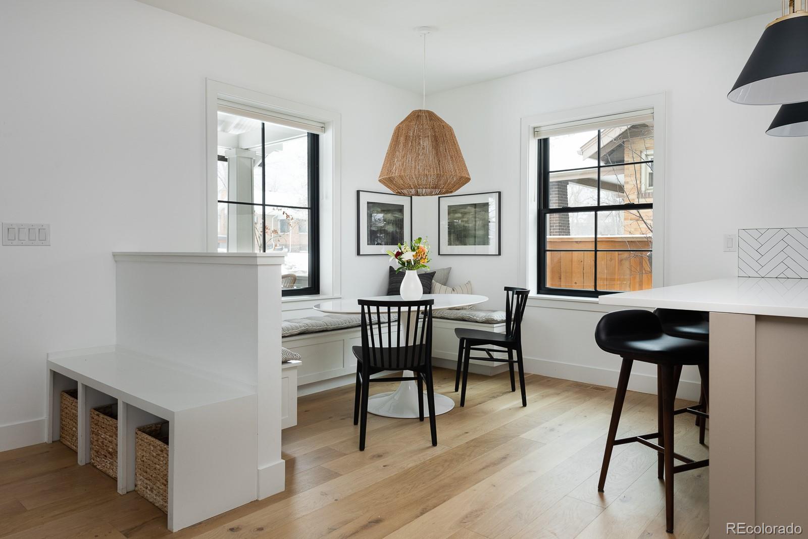 4150 Hooker Street Denver, CO 80211 - Photo 11 of 40 a living room with furniture a dining table and a piano table