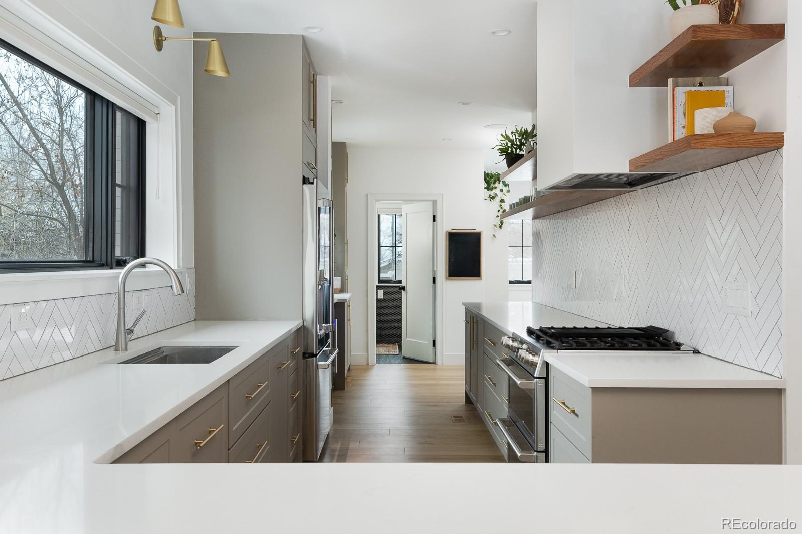 4150 Hooker Street Denver, CO 80211 - Photo 14 of 40 a kitchen with stainless steel appliances granite countertop a sink stove and refrigerator