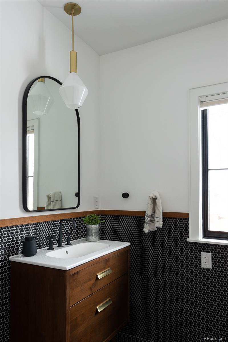 4150 Hooker Street Denver, CO 80211 - Photo 16 of 40 a bathroom with a sink and a mirror