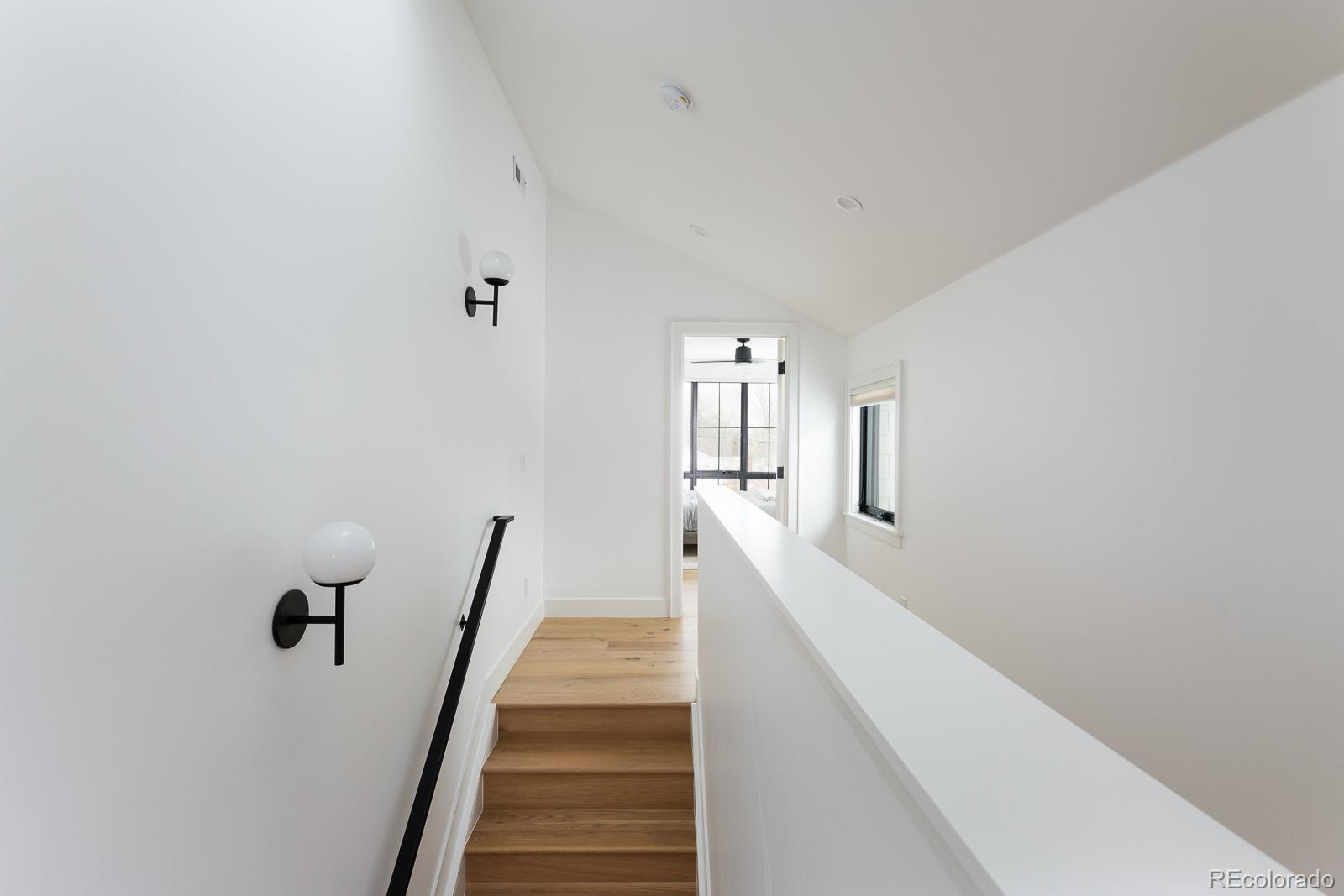 4150 Hooker Street Denver, CO 80211 - Photo 18 of 40 a view of a hallway with stairs