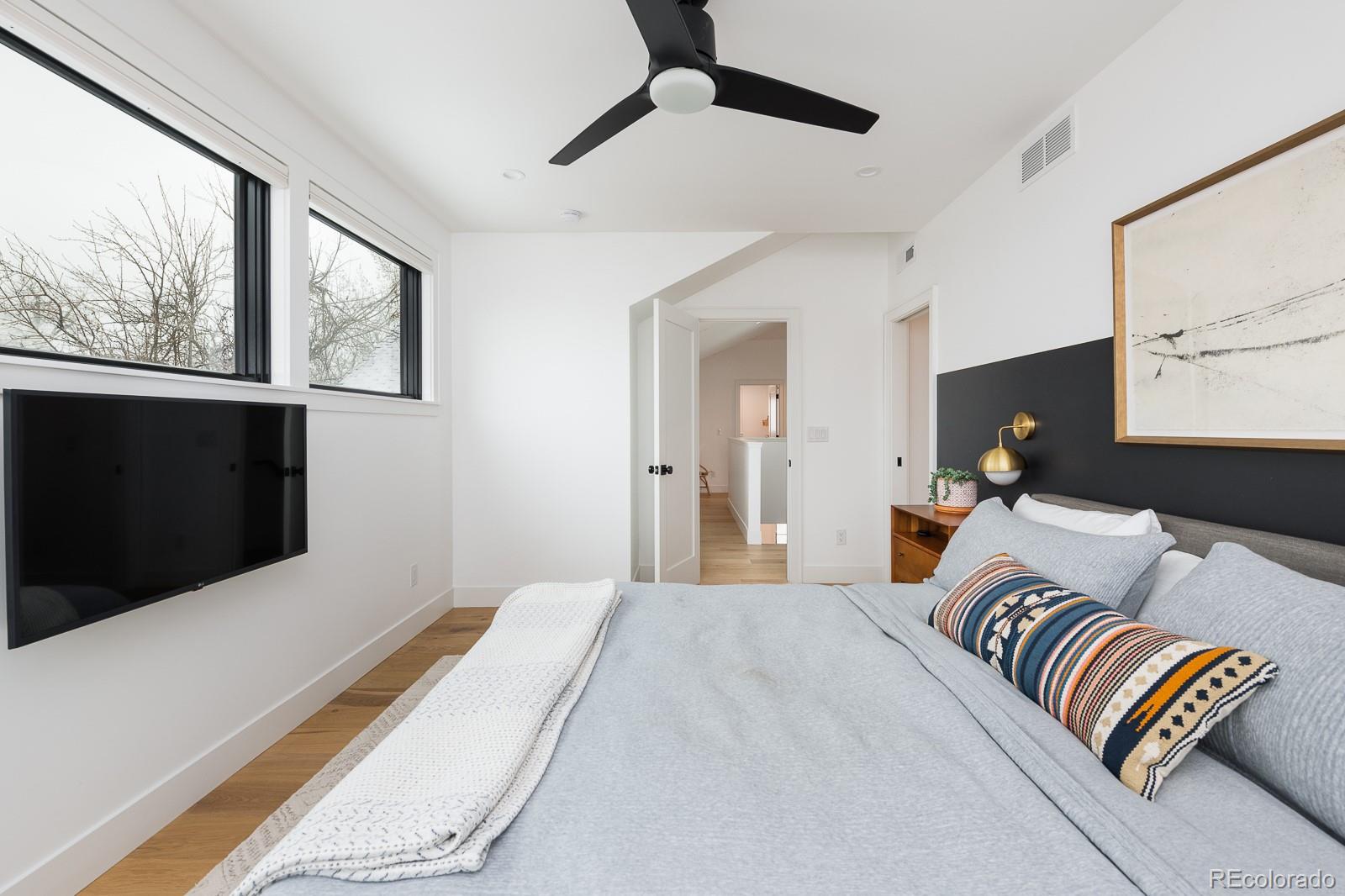 4150 Hooker Street Denver, CO 80211 - Photo 20 of 40 a bedroom with a bed and wooden floor