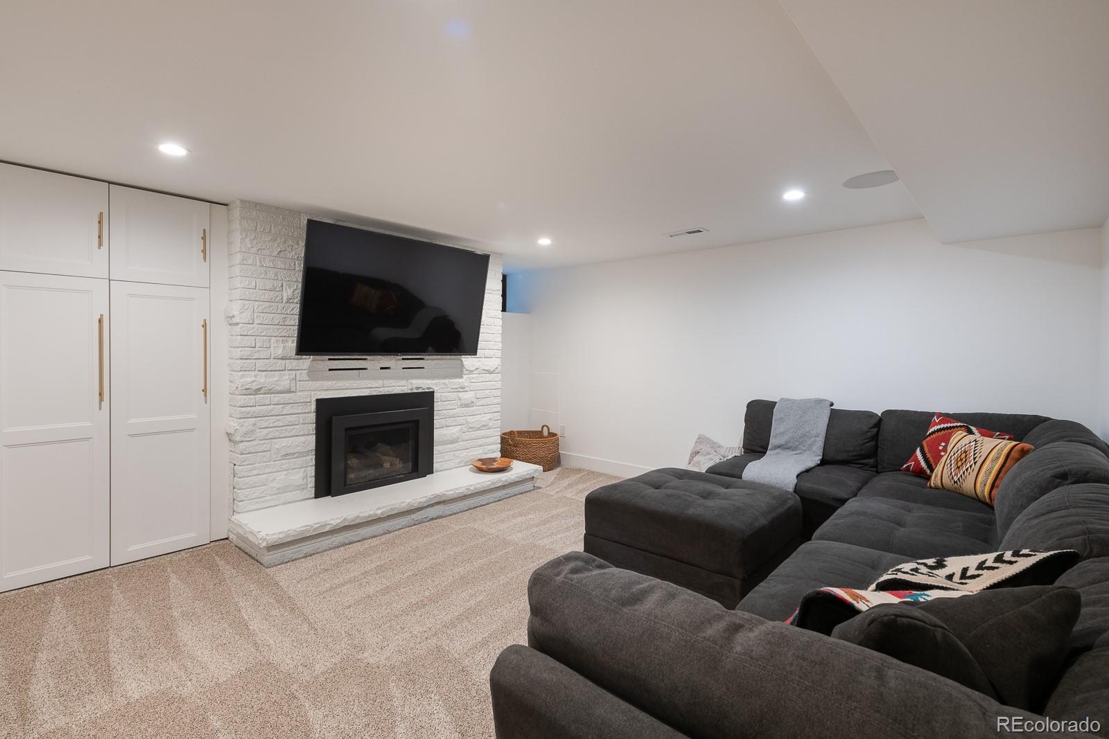 4150 Hooker Street Denver, CO 80211 - Photo 29 of 40 a living room with furniture and a flat screen tv