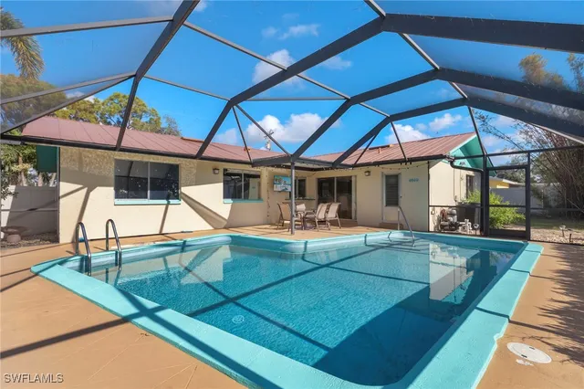 a view of house with swimming pool