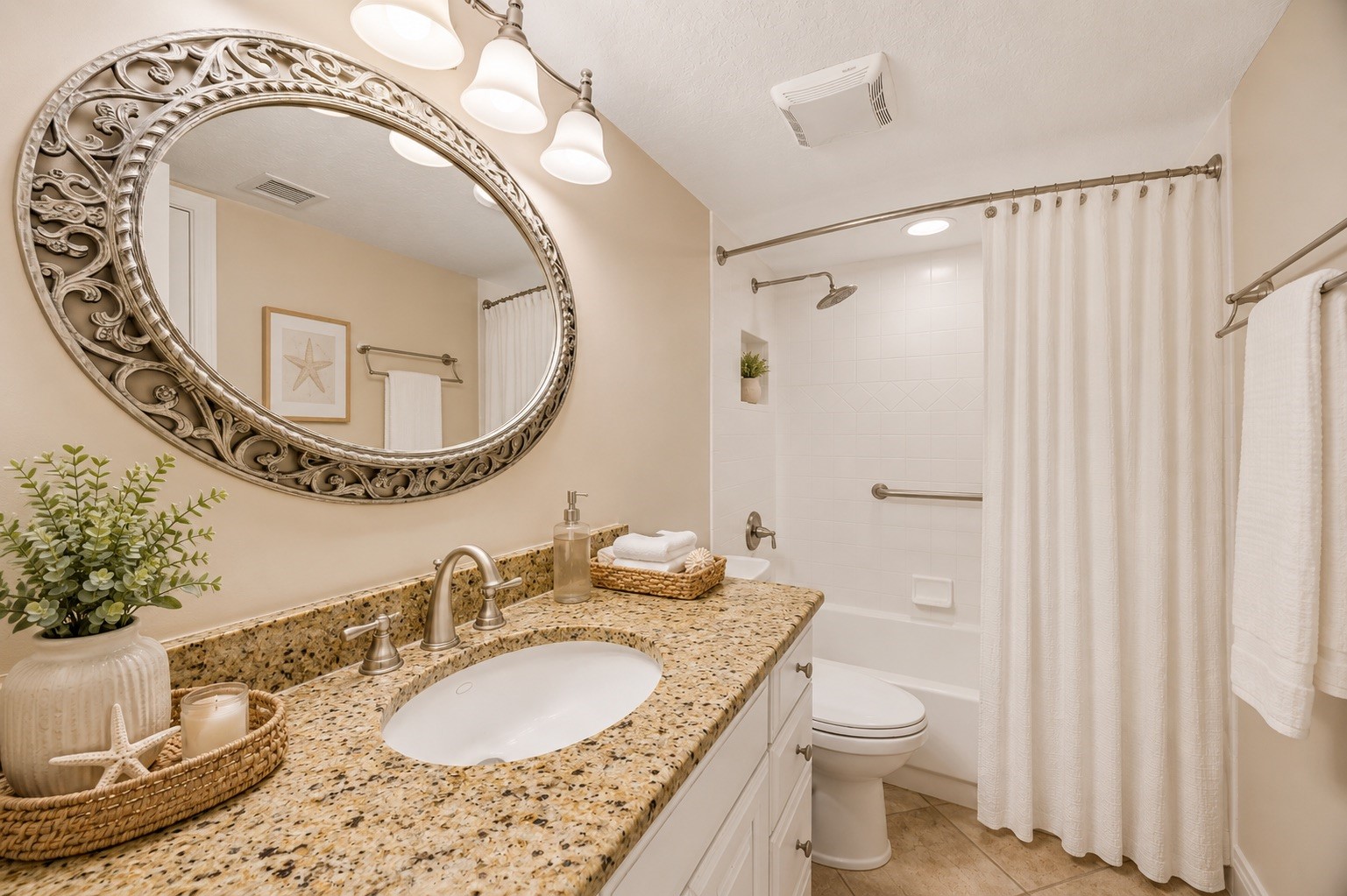 2117 Beachwood Road, Unit 2117 Fernandina Beach, FL 32034 - Photo 15 of 36 a bathroom with a granite countertop sink mirror vanity and toilet