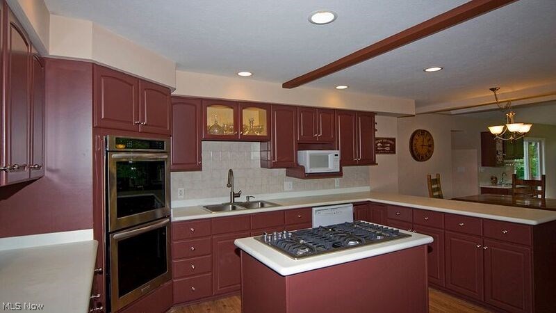 7593 Cedar Road Chesterland, OH 44026 - Photo 4 of 33 A Jenn-Air 5 burner gas cook top, a double oven, and a stainless steel refrigerator were added new in June, 2015. Corian counters plus lots of cupboards make this eat in kitchen a cook's delight.