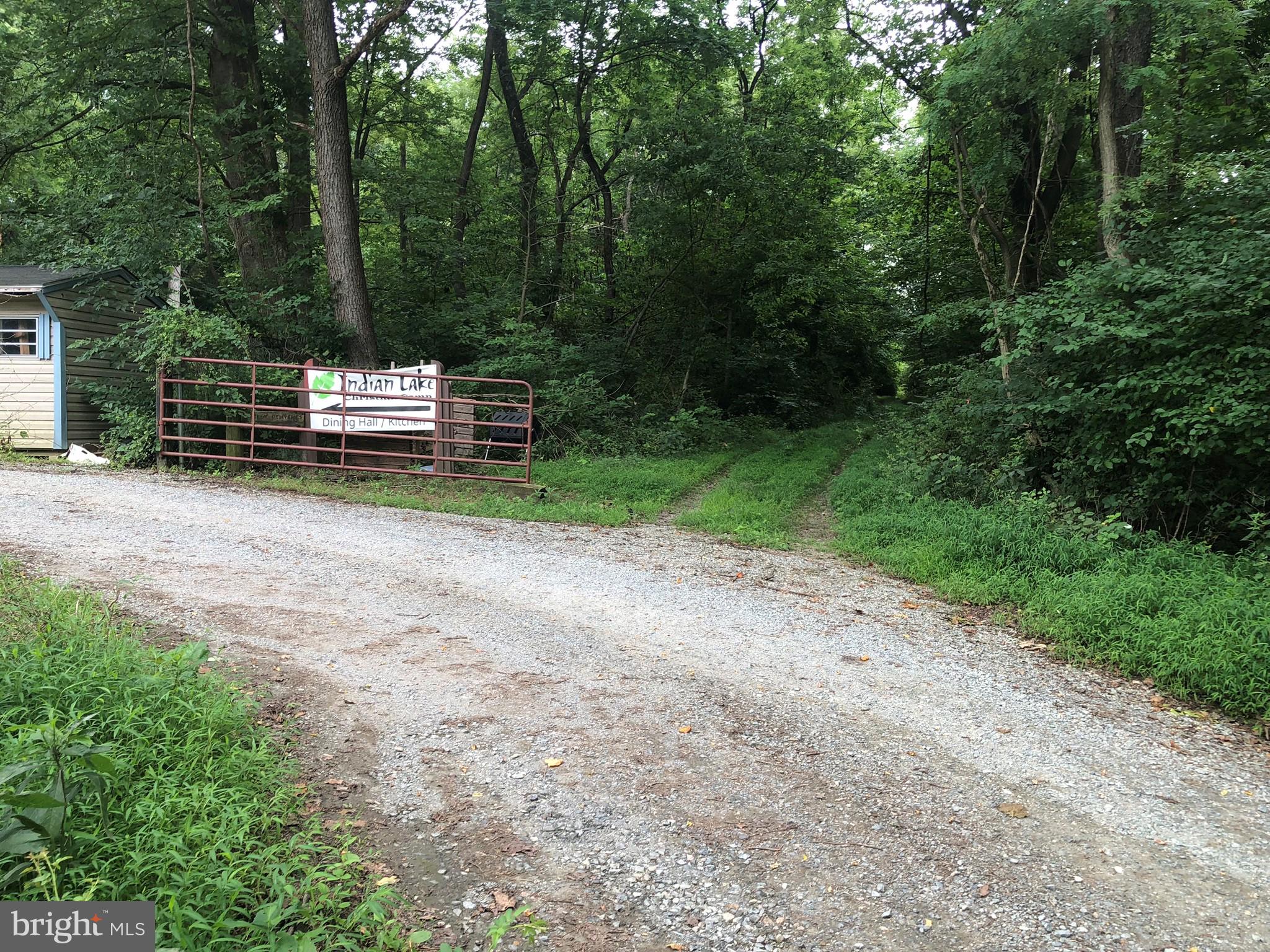 3909 River Road Darlington, MD 21034 - Photo 3 of 9 a view of a park with large trees and wooden fence