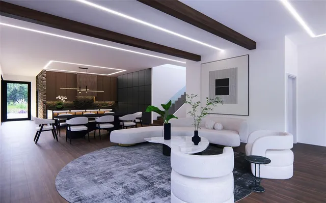 a living room with furniture and wooden floor