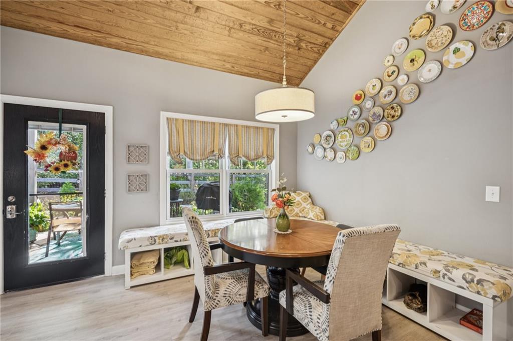 305 Wilkie Road Ball Ground, GA 30107 - Photo 13 of 37 a view of a dining room with furniture window and outside view