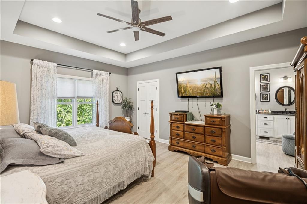 305 Wilkie Road Ball Ground, GA 30107 - Photo 18 of 37 a bedroom with furniture and a flat screen tv