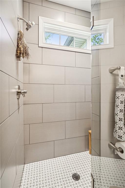 305 Wilkie Road Ball Ground, GA 30107 - Photo 25 of 37 a bathroom with a shower