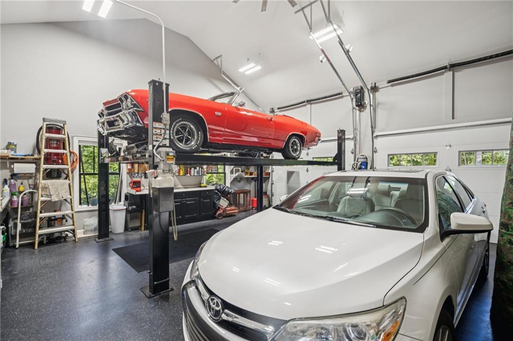 305 Wilkie Road Ball Ground, GA 30107 - Photo 27 of 37 a kitchen with stainless steel appliances granite countertop a sink a stove and a wooden floors