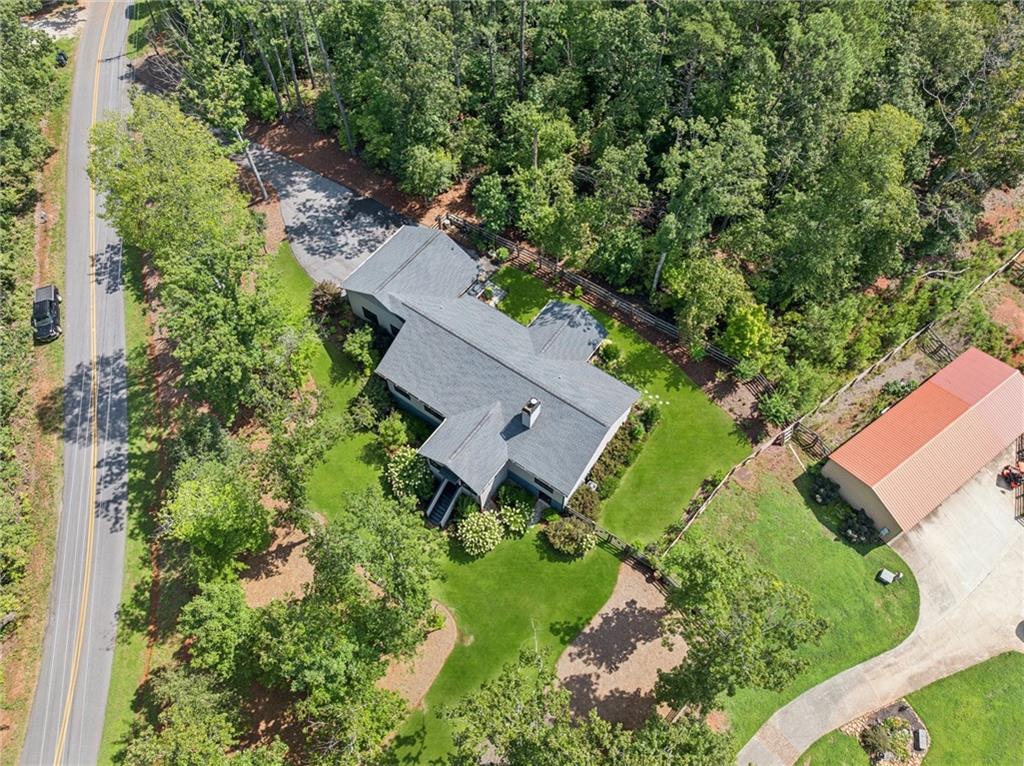 305 Wilkie Road Ball Ground, GA 30107 - Photo 33 of 37 an aerial view of a house with garden space and street view