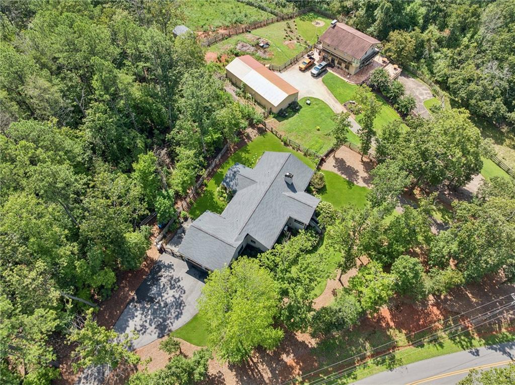 305 Wilkie Road Ball Ground, GA 30107 - Photo 34 of 37 an aerial view of house with yard