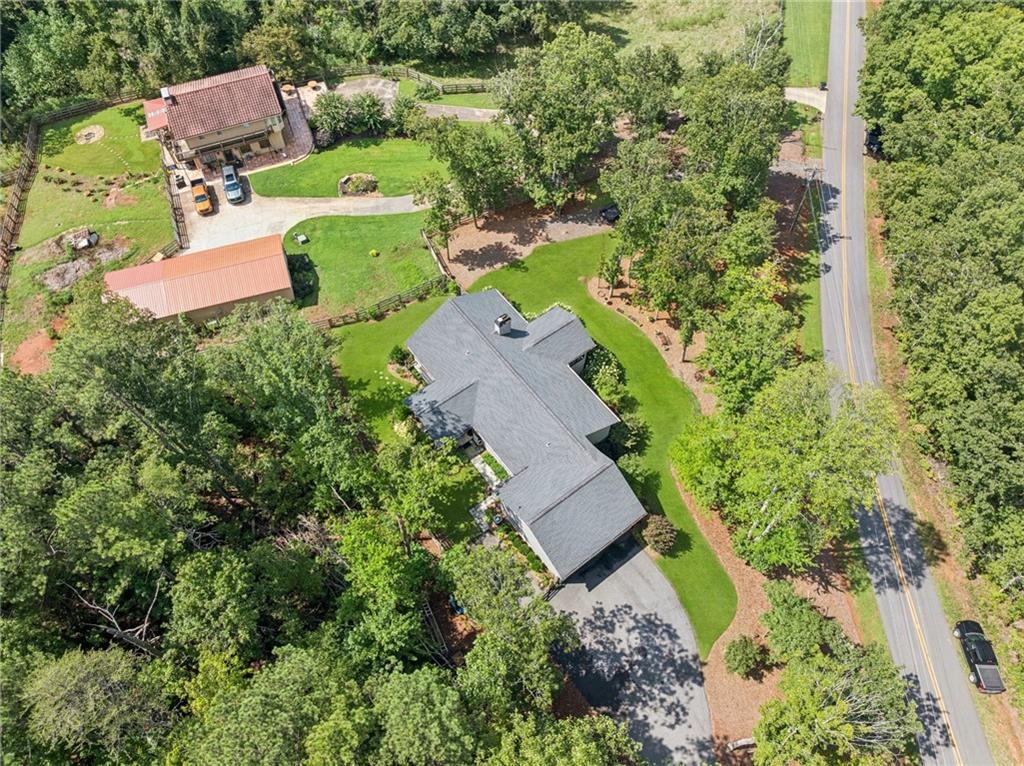 305 Wilkie Road Ball Ground, GA 30107 - Photo 35 of 37 an aerial view of a house with a garden