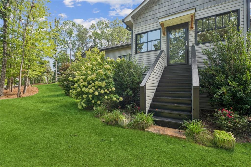 305 Wilkie Road Ball Ground, GA 30107 - Photo 5 of 37 a view of a house with a yard