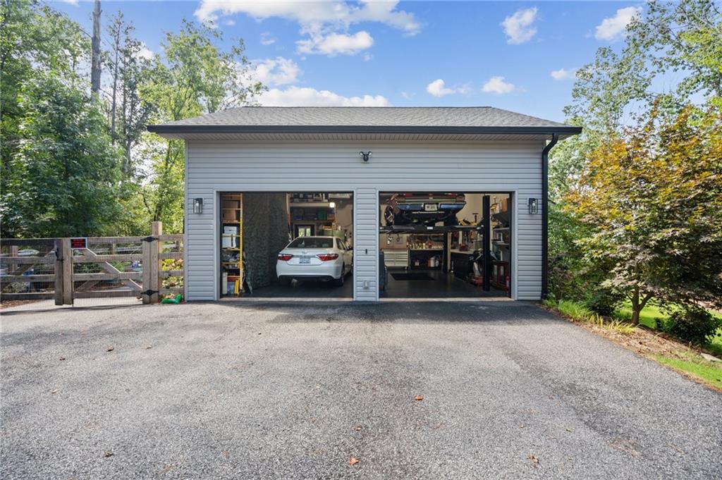 305 Wilkie Road Ball Ground, GA 30107 - Photo 7 of 37 a view of the house with outdoor space