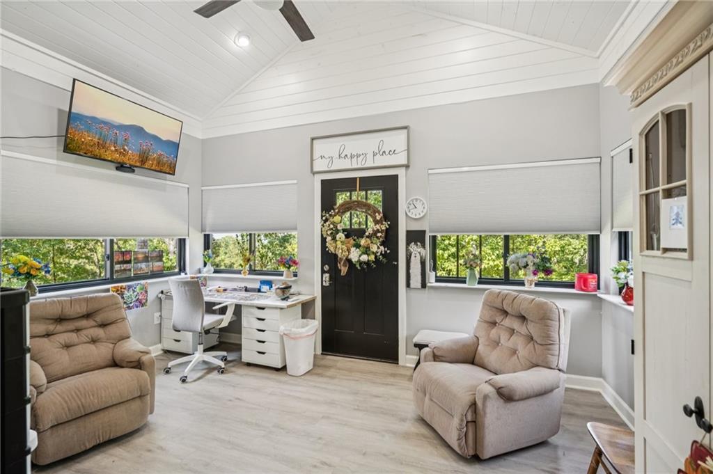 305 Wilkie Road Ball Ground, GA 30107 - Photo 8 of 37 a living room with furniture and a large window