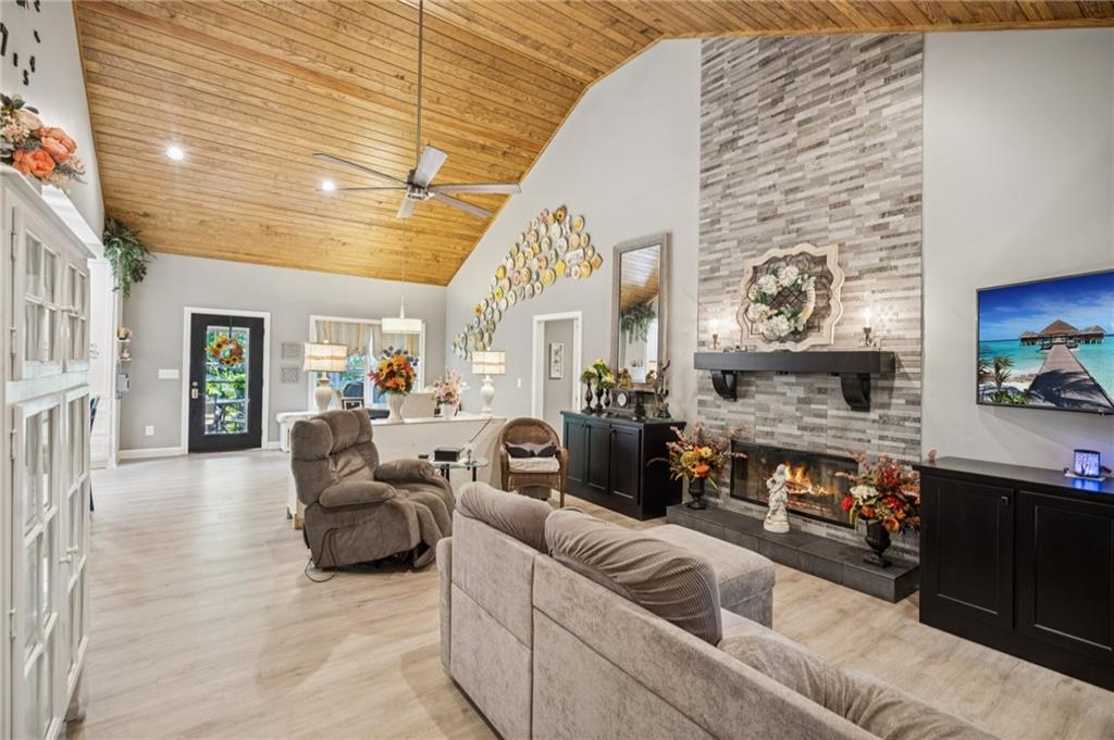 305 Wilkie Road Ball Ground, GA 30107 - Photo 10 of 37 a living room with furniture and a fireplace
