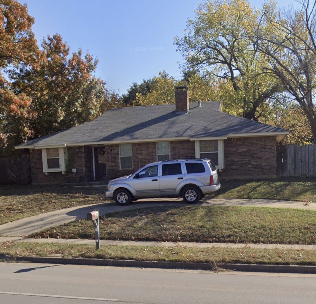 1004 Forest Ridge Drive Bedford, TX 76022 - Photo 4 of 6 a view of a house with a yard