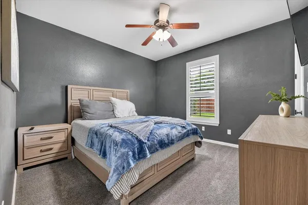 a bed room with furniture and a chandelier