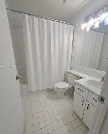 a view of a yard with large trees