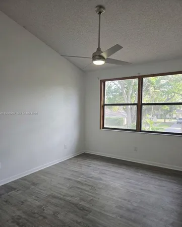 a view of a yard with sunset view