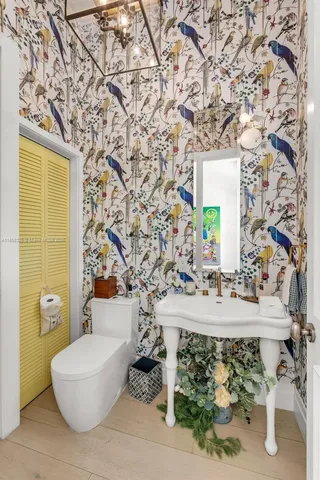 a living room with furniture a flat screen tv and a large window