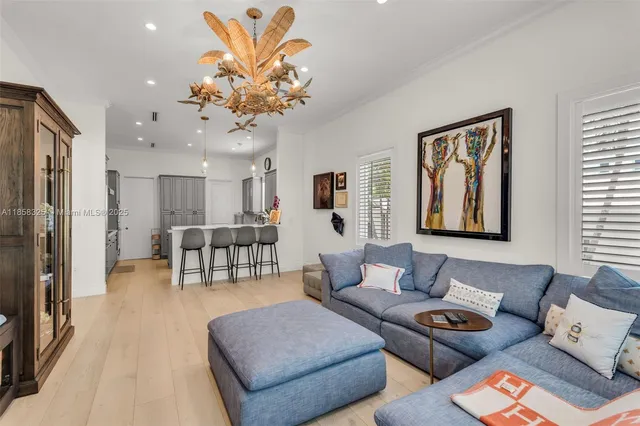 a kitchen that has a sink a table and chairs in it