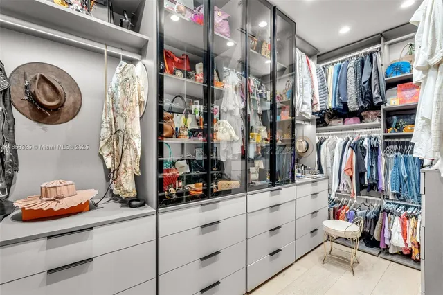 a white toilet sitting next to a bath tub shower