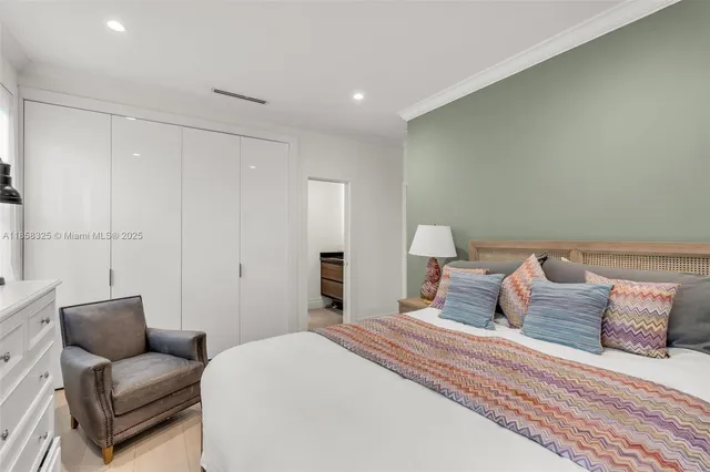 a bedroom with a bed and a table