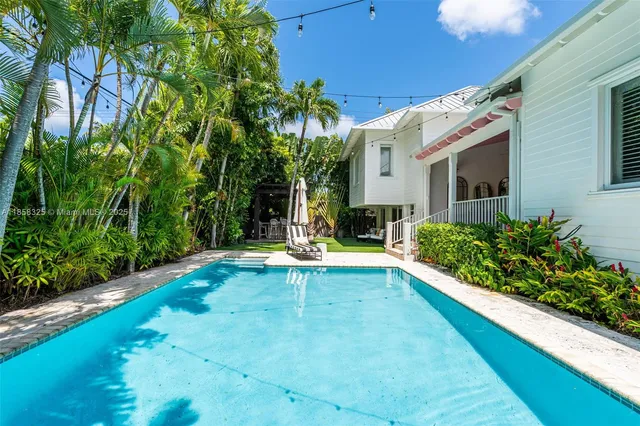 an aerial view of a house with a lake view