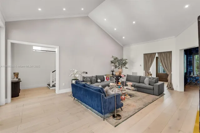 a living room with furniture large window and a flat screen tv