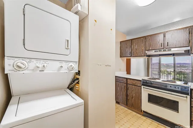 a kitchen with stainless steel appliances granite countertop a stove and a microwave