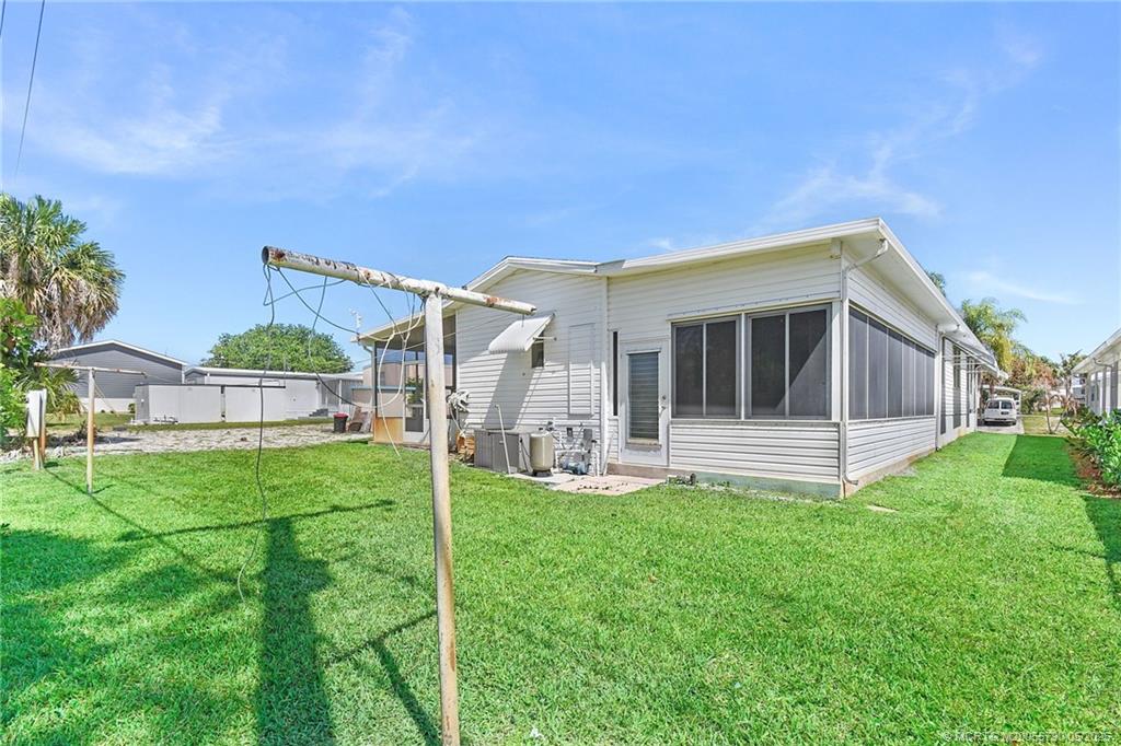 7149 Southeast Ridgeway Terrace Hobe Sound, FL 33455 - Photo 10 of 34 Large addition included this room on the back which is air conditioned