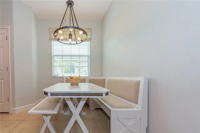 a table and a vase of flowers sitting on a table